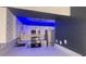 Modern white kitchen with blue LED lighting and stainless steel appliances at 3002 W Cleveland St # E1, Tampa, FL 33609
