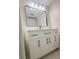 Modern bathroom with white vanity and large mirror at 3002 W Cleveland St # E1, Tampa, FL 33609