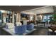 Upscale game room features comfortable seating, pool table, and large screen TV at 5701 Bowen Daniel Dr. # 1505, Tampa, FL 33616