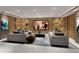 Elegant media room featuring built-in shelving and comfortable seating at 5701 Bowen Daniel Dr. # 1505, Tampa, FL 33616