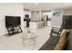 Open-concept living area seamlessly connects to a modern kitchen, creating a spacious and inviting atmosphere at 11883 Brighton Knoll Loop, Riverview, FL 33579