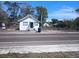 Charming single-story home with peaked roof and a 'For Sale' sign in the front yard at 2001 15Th S Ave, St Petersburg, FL 33712