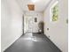 Clean unfinished basement space with visible utility components and access to other areas at 2222 Greenhaven Dr, Sun City Center, FL 33573