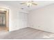 Well-lit bedroom with double closet, neutral carpeting, and a ceiling fan at 2222 Greenhaven Dr, Sun City Center, FL 33573
