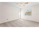 Bright, carpeted bedroom with a ceiling fan and natural light from a window at 2222 Greenhaven Dr, Sun City Center, FL 33573