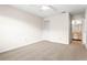 Spacious bedroom with neutral carpeting, closet, ceiling fan, and adjacent bathroom at 2222 Greenhaven Dr, Sun City Center, FL 33573