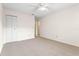 Calm bedroom with a ceiling fan and neutral carpet at 2222 Greenhaven Dr, Sun City Center, FL 33573