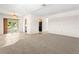 Spacious open-concept living room boasts ample natural light and neutral tones at 2222 Greenhaven Dr, Sun City Center, FL 33573