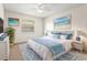 Serene main bedroom features a comfortable bed, stylish decor, and a ceiling fan at 2222 Greenhaven Dr, Sun City Center, FL 33573