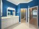 Bathroom with double vanity and toilet at 4977 Sapphire Sound Dr, Wimauma, FL 33598