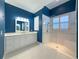 Bathroom with double vanity and walk-in shower at 4977 Sapphire Sound Dr, Wimauma, FL 33598