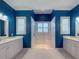 Spa-like bathroom with a large walk-in shower and double vanity at 4977 Sapphire Sound Dr, Wimauma, FL 33598