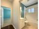 Clean bathroom with white vanity, shower, and bathtub at 4977 Sapphire Sound Dr, Wimauma, FL 33598