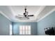 Bedroom with ceiling fan and white shutters at 4977 Sapphire Sound Dr, Wimauma, FL 33598