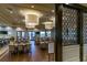 Community dining area with tables, chairs, and access to the pool at 4977 Sapphire Sound Dr, Wimauma, FL 33598