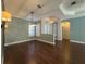 Elegant dining room with hardwood floors and a statement light fixture at 4977 Sapphire Sound Dr, Wimauma, FL 33598