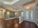 Bright dining room with hardwood floors and a modern chandelier at 4977 Sapphire Sound Dr, Wimauma, FL 33598