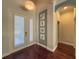 Bright entryway with white doors and hardwood floors at 4977 Sapphire Sound Dr, Wimauma, FL 33598