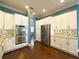 Well-equipped kitchen with stainless steel appliances and ample cabinet space at 4977 Sapphire Sound Dr, Wimauma, FL 33598