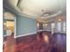 Spacious living room featuring hardwood floors and an open floor plan at 4977 Sapphire Sound Dr, Wimauma, FL 33598