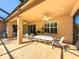 Spacious patio features a dining area and views of the pool at 4977 Sapphire Sound Dr, Wimauma, FL 33598