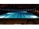Community pool at night with lights illuminating the water at 4977 Sapphire Sound Dr, Wimauma, FL 33598