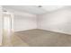 Spacious living room with carpeted floors at 2222 Greenhaven Dr, Sun City Center, FL 33573