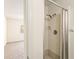 Bathroom shower with tiled walls and glass door at 2222 Greenhaven Dr, Sun City Center, FL 33573