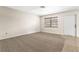 Living room with carpet and access to exterior at 2222 Greenhaven Dr, Sun City Center, FL 33573