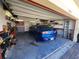 Garage with car, storage shelves, and American flag at 11883 Brighton Knoll Loop, Riverview, FL 33579