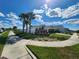 Community entrance with street sign and landscaping at 11883 Brighton Knoll Loop, Riverview, FL 33579