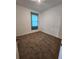 Well-lit bedroom featuring carpet and teal curtains at 11883 Brighton Knoll Loop, Riverview, FL 33579