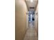 Clean hallway with tile floors and doors to rooms at 11883 Brighton Knoll Loop, Riverview, FL 33579