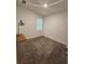 Bright bedroom with carpeted floor and a window at 11883 Brighton Knoll Loop, Riverview, FL 33579
