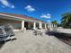 Community pool area with lounge chairs, tables, and umbrellas at 11883 Brighton Knoll Loop, Riverview, FL 33579