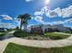 Community entrance with signage and landscaping at 11883 Brighton Knoll Loop, Riverview, FL 33579