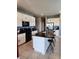 Modern kitchen with white cabinets, granite counters, and island at 11883 Brighton Knoll Loop, Riverview, FL 33579