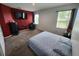 Spacious bedroom with carpeted floor, large TV, and window at 11883 Brighton Knoll Loop, Riverview, FL 33579