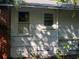 White side of house with two windows and brick chimney at 2001 15Th S Ave, St Petersburg, FL 33712