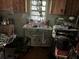 Kitchen with double sink and wood cabinets at 2001 15Th S Ave, St Petersburg, FL 33712