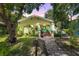 Charming yellow house with landscaped yard at 810 E New Orleans Ave, Tampa, FL 33603