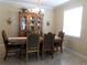 Elegant dining room featuring a large table, hutch, and chandelier at 2387 Bartolo Dr, Land O Lakes, FL 34639