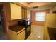 Kitchen features tile floors, light wood cabinets, and an electric range at 1601 43Rd S N St # 224, St Petersburg, FL 33713