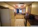 Retro kitchen design with light yellow cabinets and marble countertops at 1601 43Rd S N St # 224, St Petersburg, FL 33713