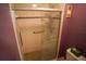 Shower stall with safety bars, glass door, and tile floor at 1601 43Rd S N St # 224, St Petersburg, FL 33713