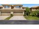 Charming home with two-car garage, well-kept lawn, and attractive landscaping at 2539 Silverback Ct, Palm Harbor, FL 34684