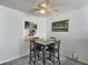 Dining area with a small table and four chairs at 8651 10Th N St # 118, St Petersburg, FL 33702