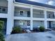Condo building showcasing a renovated facade and landscaping at 8651 10Th N St # 118, St Petersburg, FL 33702