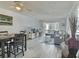 Open living room and dining area with gray sectional sofa at 8651 10Th N St # 118, St Petersburg, FL 33702