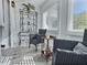 Sunroom showcasing wicker chairs, a table, and a display cabinet at 8651 10Th N St # 118, St Petersburg, FL 33702